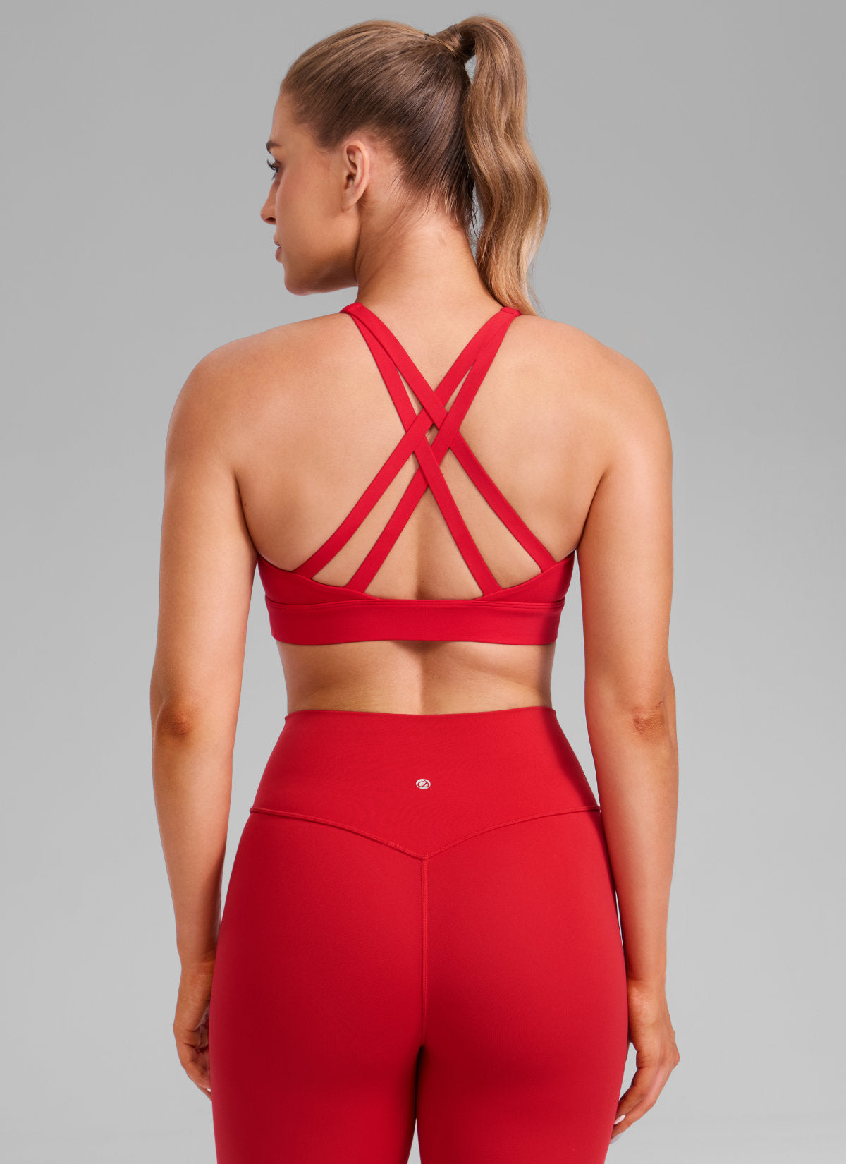 CRZ YOGA Women's Butterlift® Workout Crewneck Cross Back Sports Bra Aurora Red @model_info:Julia