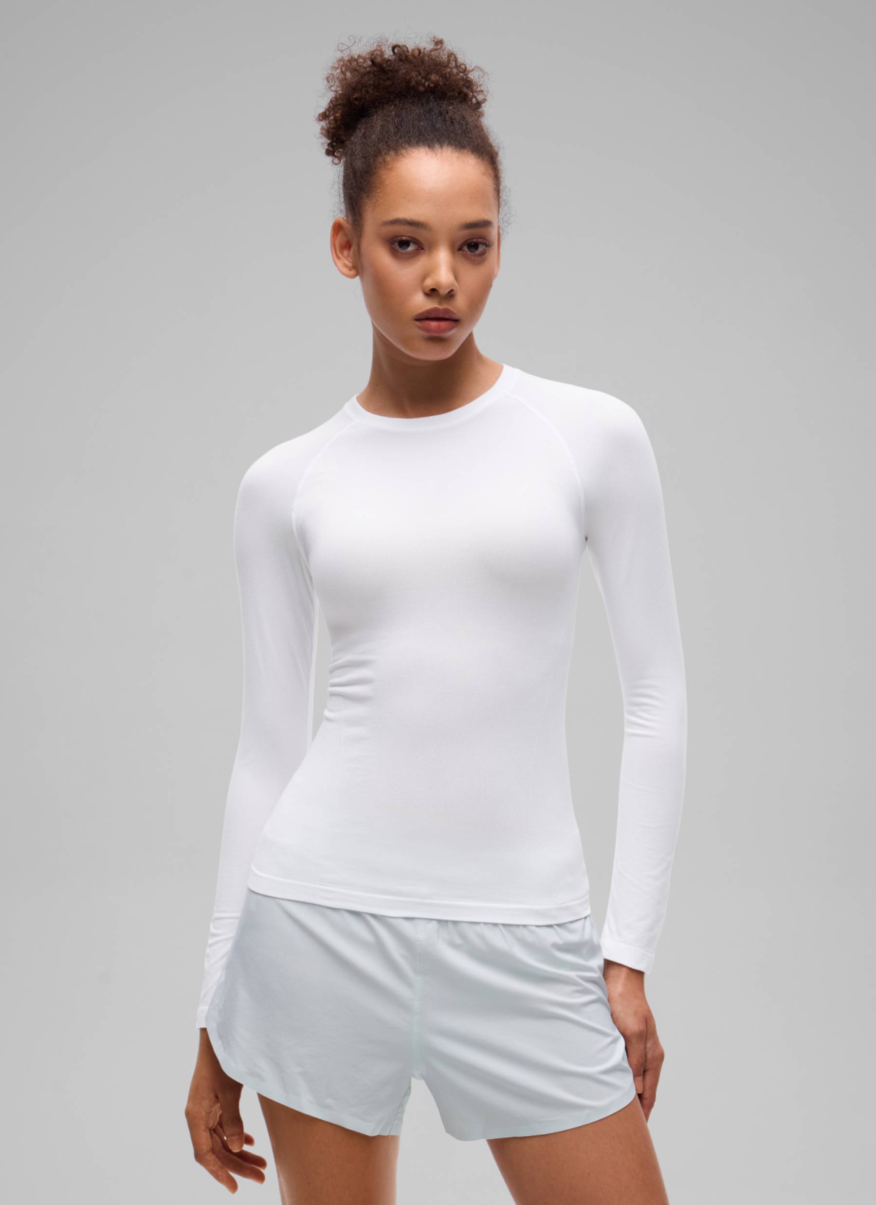CRZ YOGA Women's Flex Seamless Fitted Workout Hip Length Long Sleeve White @model_info:B