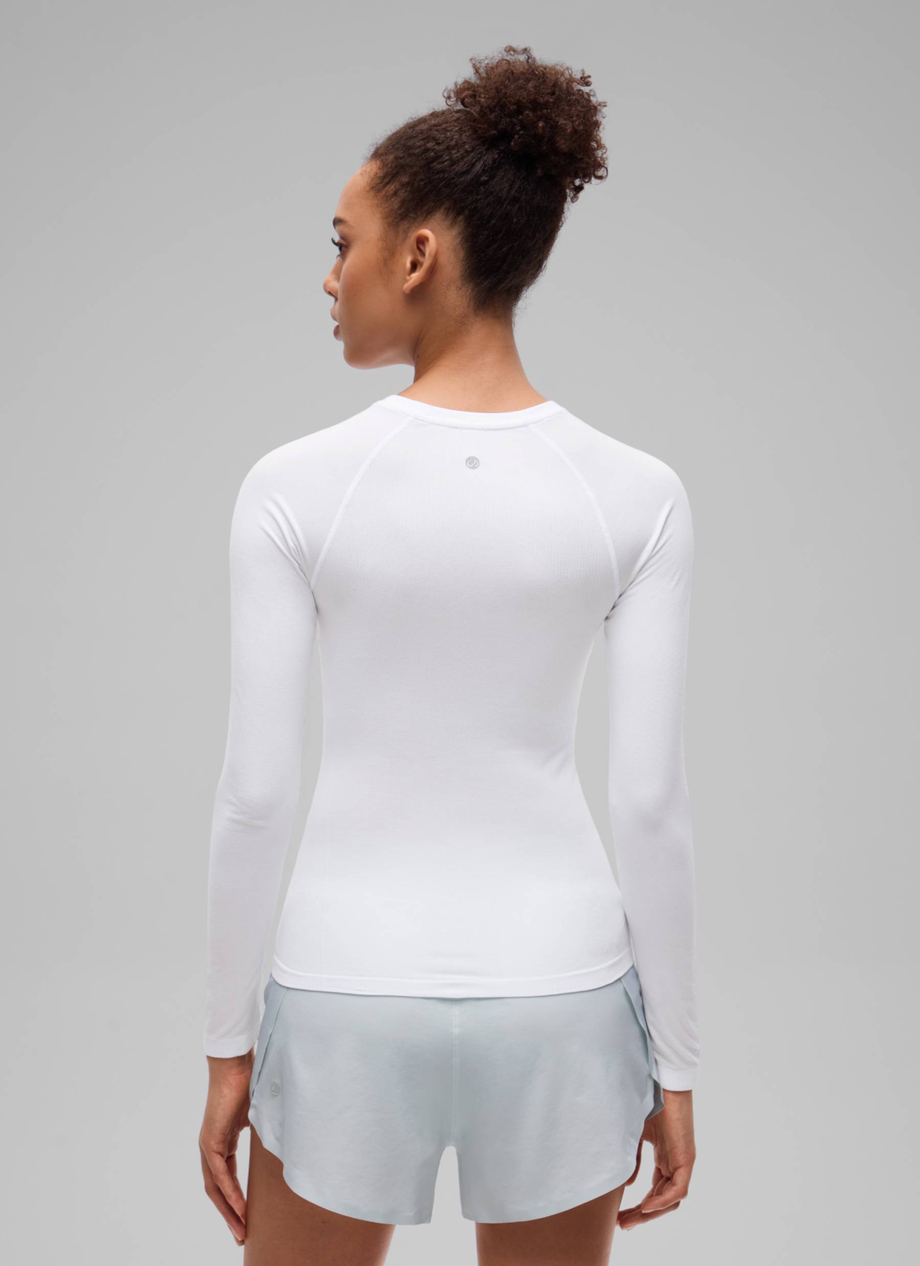 CRZ YOGA Women's Flex Seamless Fitted Workout Hip Length Long Sleeve White @model_info:B