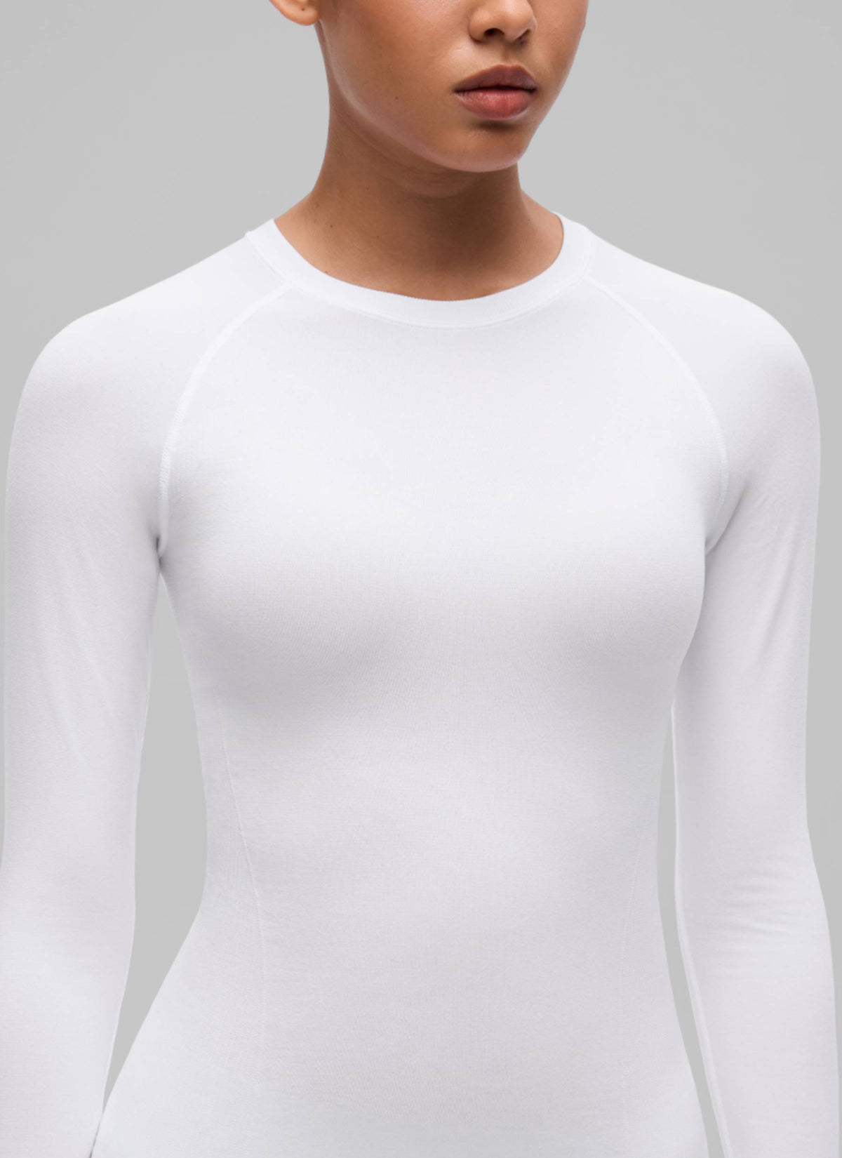 CRZ YOGA Women's Flex Seamless Fitted Workout Hip Length Long Sleeve White @model_info:B