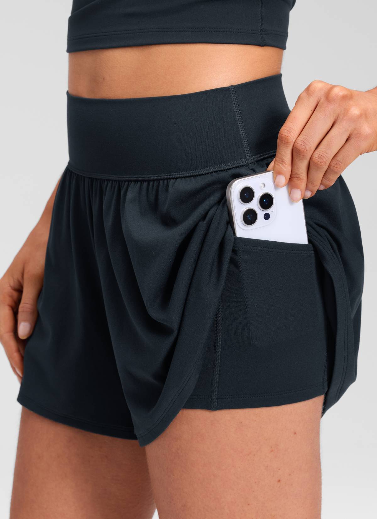 CRZ YOGA Women's Softretch Yoga High Rise Pocket Flowy 2 in 1 Shorts True Navy @model_info:Marcela