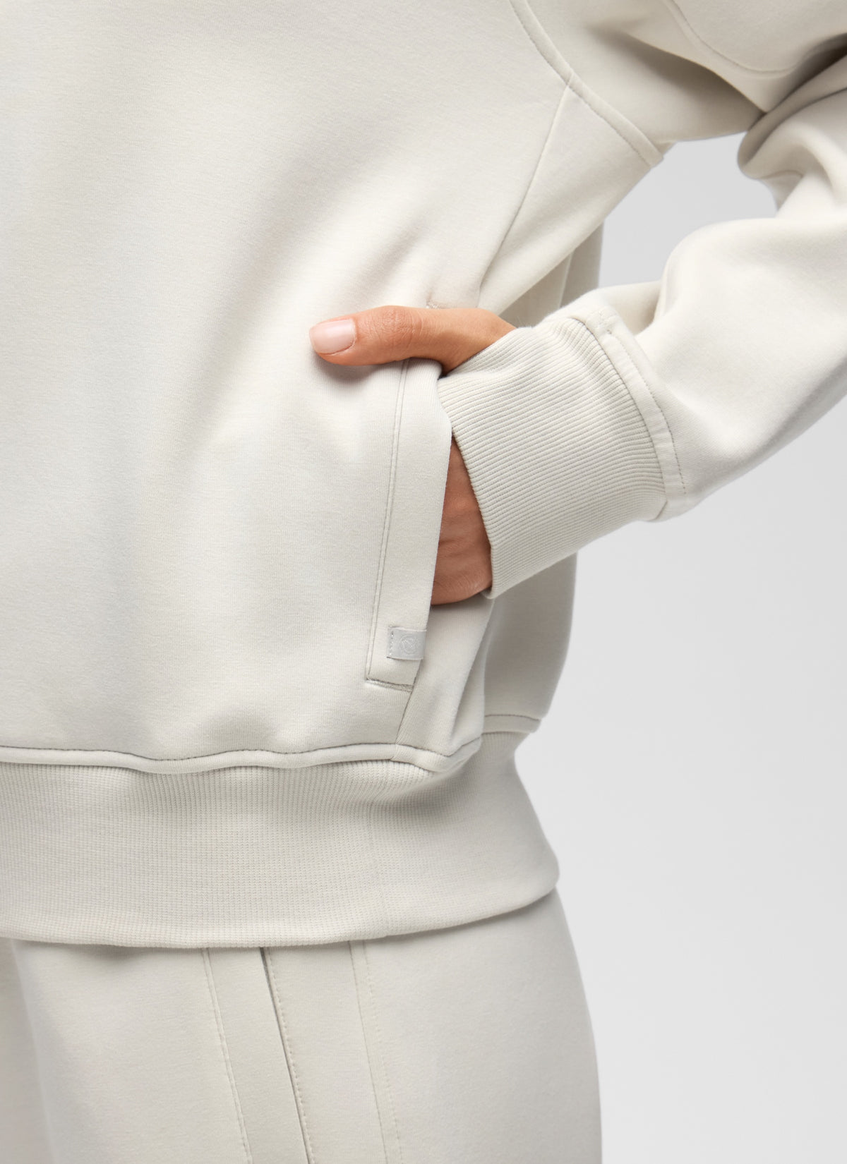 CRZ YOGA Women's HugSpacer Half-Zip Waist Length Pocket Sweatshirt Milky White @model_info:V